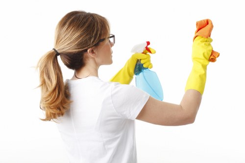 Team member applying workplace safety controls during cleaning operations